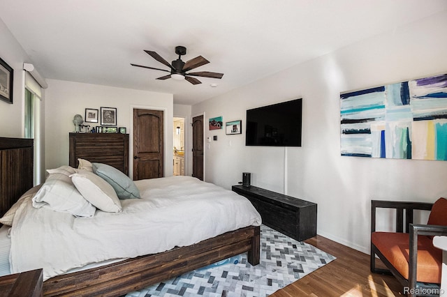 8315 Woodland Cir, Goodrich, MI 48438 - bedroom featuring wood finished floors, baseboards, and a ceiling fan