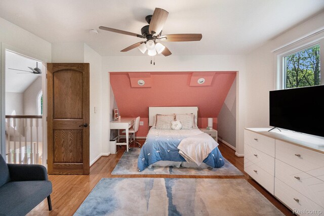 8315 Woodland Cir, Goodrich, MI 48438 - bedroom featuring light wood-type flooring, baseboards, and ceiling fan
