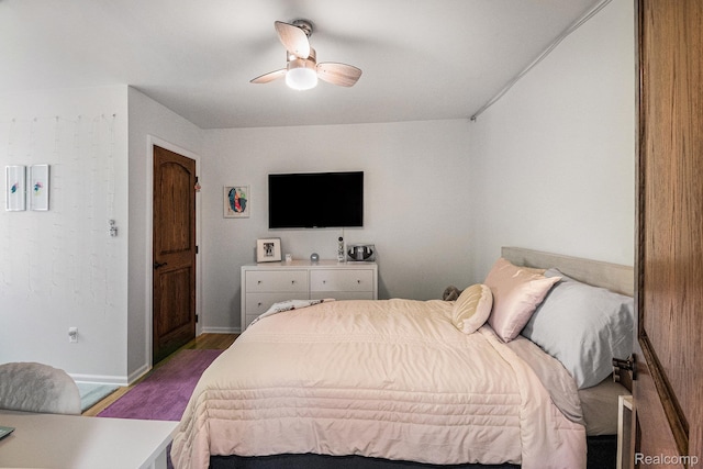 8315 Woodland Cir, Goodrich, MI 48438 - bedroom featuring wood finished floors, baseboards, and a ceiling fan