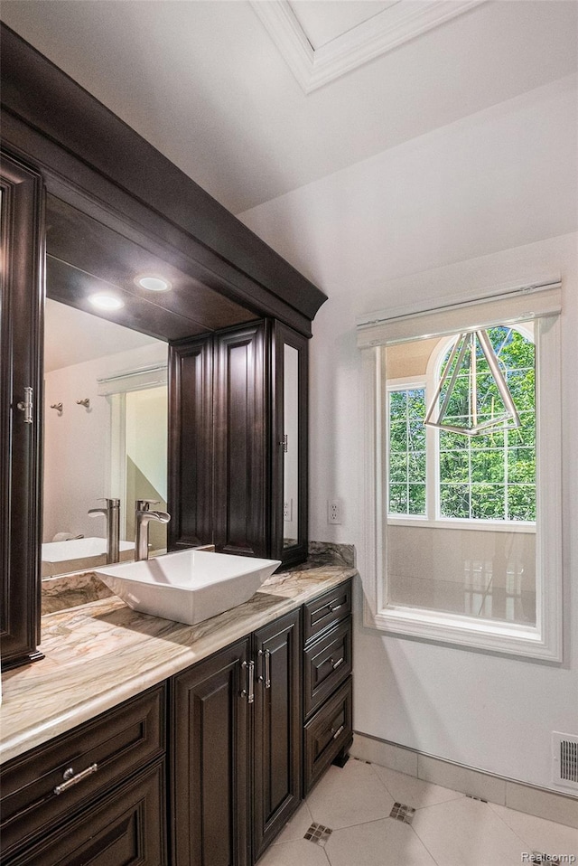 8315 Woodland Cir, Goodrich, MI 48438 - bathroom with vanity, tile patterned floors, and baseboards