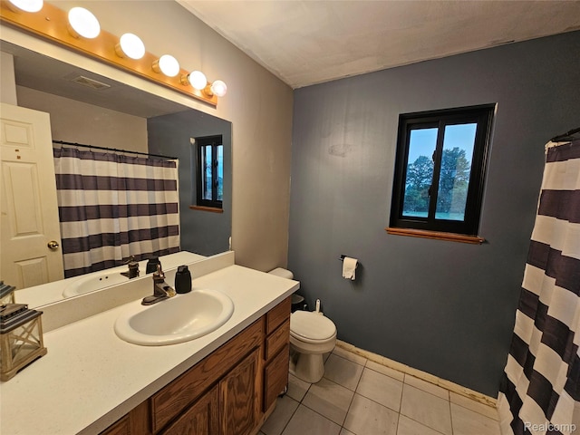 11103 Hill Rd, Swartz Creek, MI 48473 - bathroom featuring vanity, toilet, tile patterned flooring, baseboards, and curtained shower