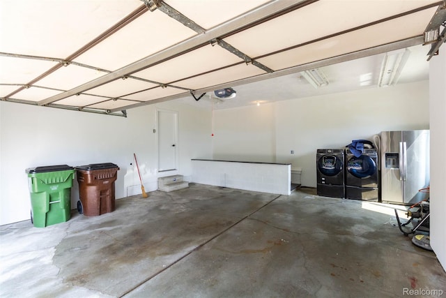 56259 Schoenherr Rd, Shelby Twp, MI 48315 - garage with stainless steel refrigerator with ice dispenser, washing machine and dryer, and a garage door opener