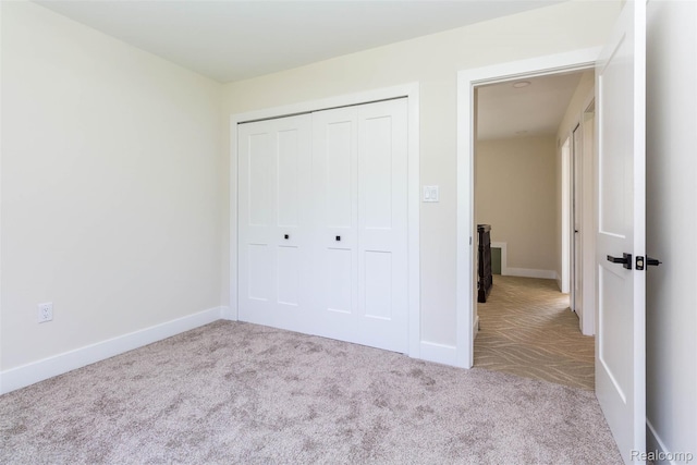 56259 Schoenherr Rd, Shelby Twp, MI 48315 - unfurnished bedroom with carpet, a closet, and baseboards