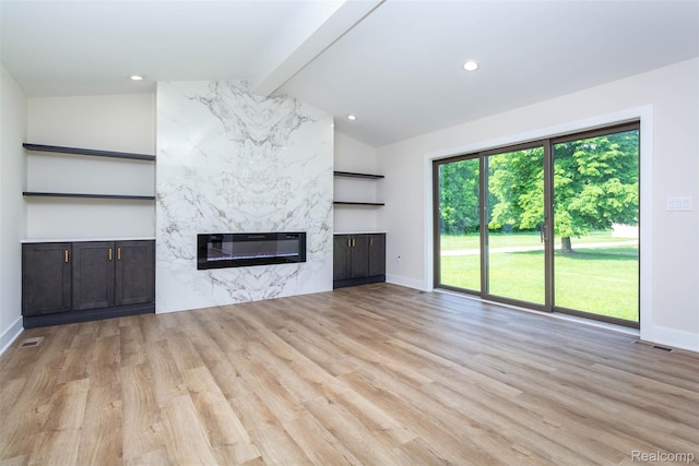 56259 Schoenherr Rd, Shelby Twp, MI 48315 - unfurnished living room featuring baseboards, a premium fireplace, wood finished floors, and recessed lighting