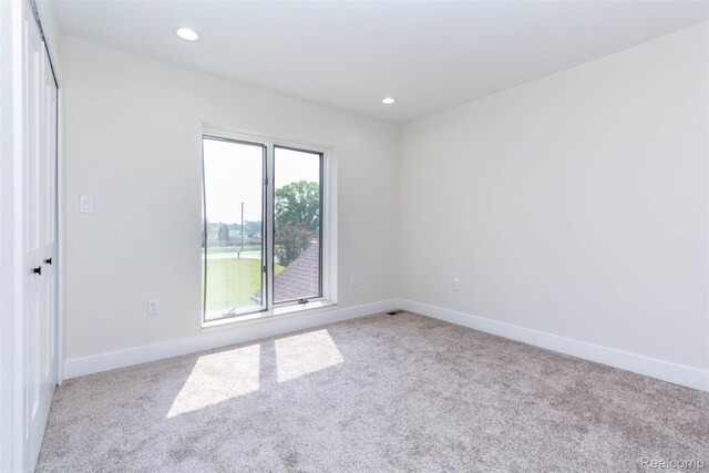 56259 Schoenherr Rd, Shelby Twp, MI 48315 - carpeted empty room with baseboards and recessed lighting