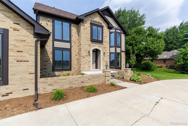 56259 Schoenherr Rd, Shelby Twp, MI 48315 - view of front of house featuring brick siding