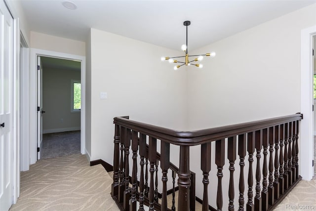56259 Schoenherr Rd, Shelby Twp, MI 48315 - corridor featuring light colored carpet, a chandelier, baseboards, and an upstairs landing