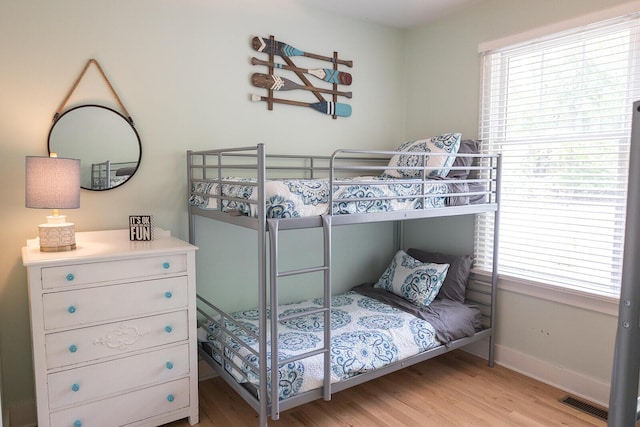 9720 Woodlawn Ave, Union Pier, MI 49129 - bedroom featuring light wood finished floors, multiple windows, and baseboards