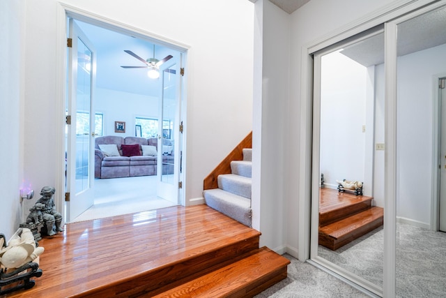 6660 Pine Rd, Benton Harbor, MI 49022 - stairs with ceiling fan, carpet flooring, and baseboards