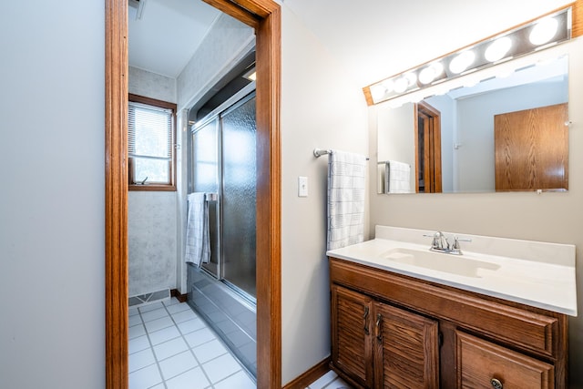 6660 Pine Rd, Benton Harbor, MI 49022 - full bathroom featuring vanity, tile patterned floors, bath / shower combo with glass door, and baseboards