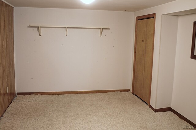 2683 Elmwood Dr, Adrian, MI 49221 - unfurnished bedroom featuring light colored carpet and baseboards