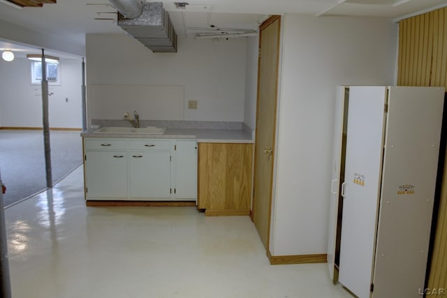 2683 Elmwood Dr, Adrian, MI 49221 - kitchen with a sink, light countertops, and white cabinets
