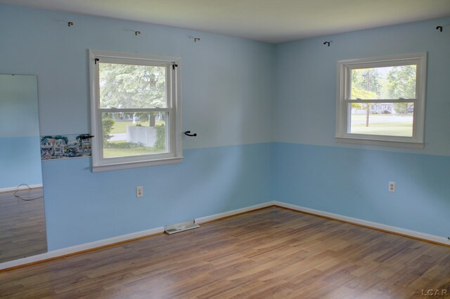 2683 Elmwood Dr, Adrian, MI 49221 - spare room with wood finished floors and baseboards