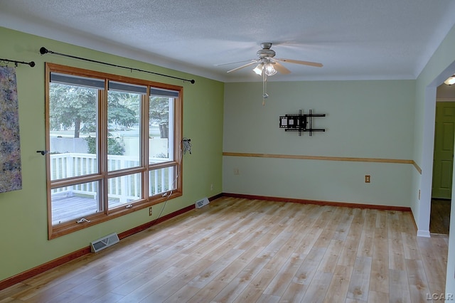 2683 Elmwood Dr, Adrian, MI 49221 - spare room with a ceiling fan, light wood-style flooring, and baseboards