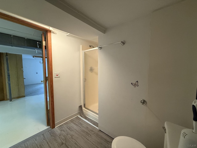 2683 Elmwood Dr, Adrian, MI 49221 - bathroom featuring toilet, a stall shower, and wood finished floors