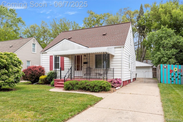 919 Whitcomb Ave, Royal Oak, MI 48073 - view of front of home with a shingled roof, covered porch, an outdoor structure, crawl space, and a detached garage