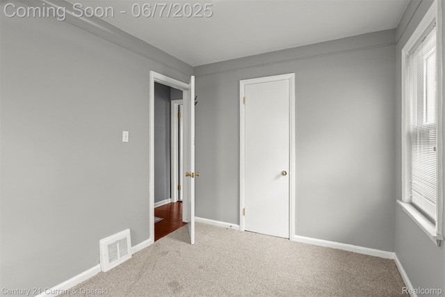 919 Whitcomb Ave, Royal Oak, MI 48073 - unfurnished bedroom featuring carpet flooring and baseboards