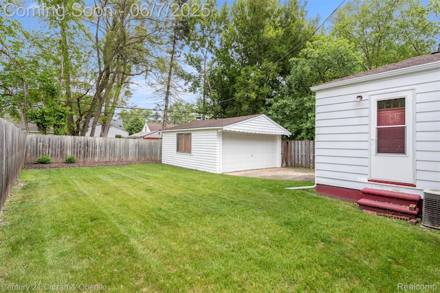 919 Whitcomb Ave, Royal Oak, MI 48073 - view of yard featuring entry steps, a garage, an outbuilding, and central air condition unit