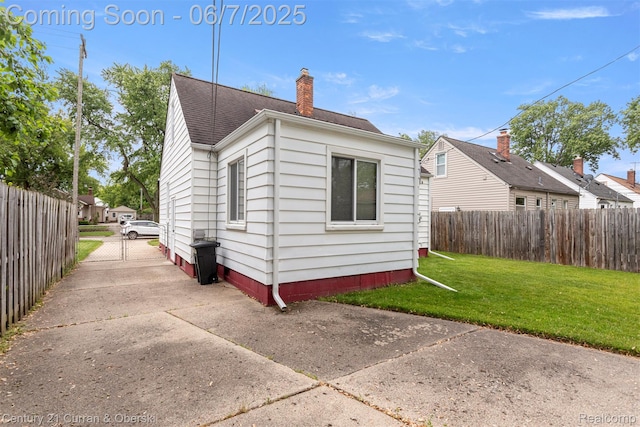 919 Whitcomb Ave, Royal Oak, MI 48073 - rear view of house featuring a chimney, roof with shingles, and a gate