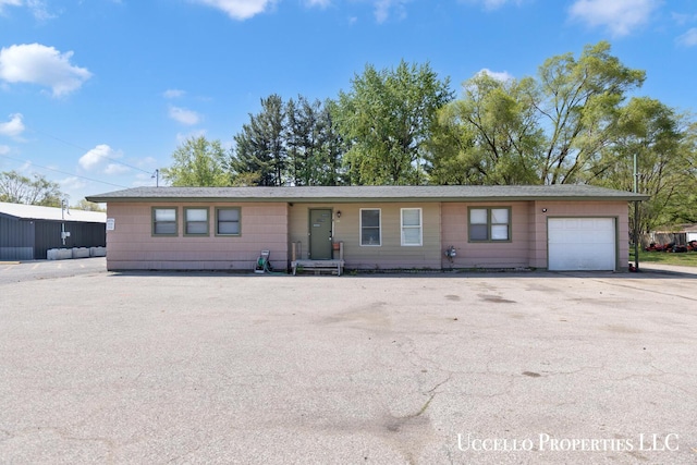 4505 E Apple Ave, Muskegon, MI 49442 - ranch-style home featuring an attached garage