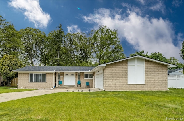 24970 Thorndyke St, Southfield, MI 48033 - view of front facade featuring brick siding, an attached garage, and concrete driveway