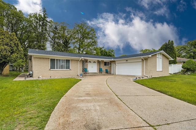24970 Thorndyke St, Southfield, MI 48033 - ranch-style house featuring brick siding, a garage, and driveway