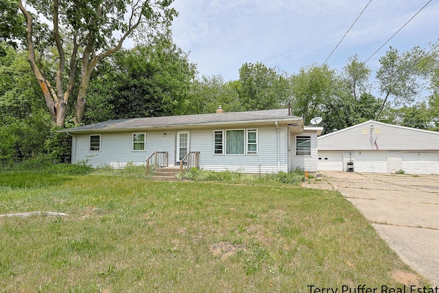 607 66th St SE, Grand Rapids, MI 49548 - ranch-style home with a detached garage, an outbuilding, and a front lawn