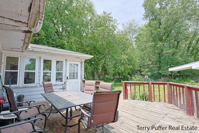 607 66th St SE, Grand Rapids, MI 49548 - deck featuring outdoor dining area