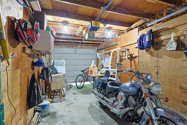 607 66th St SE, Grand Rapids, MI 49548 - garage featuring a garage door opener