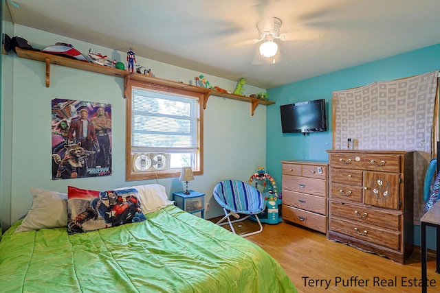 607 66th St SE, Grand Rapids, MI 49548 - bedroom with wood finished floors and ceiling fan