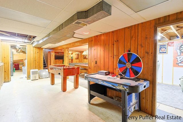 607 66th St SE, Grand Rapids, MI 49548 - game room with wooden walls and tile patterned floors