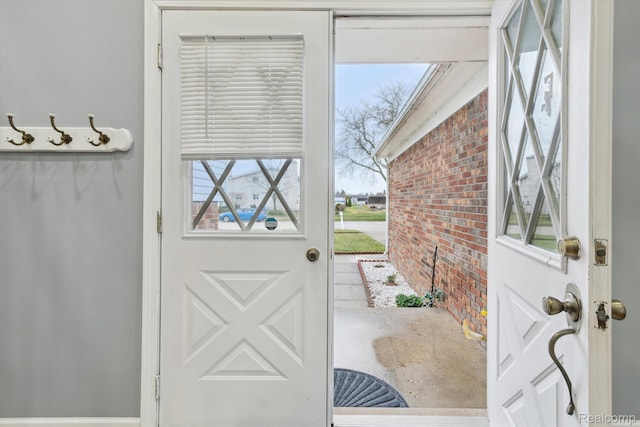13439 Brougham Dr, Warren, MI 48312 - doorway to outside featuring brick wall