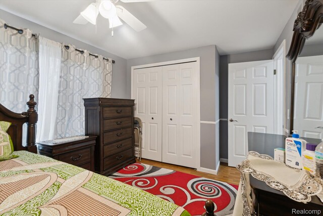 13439 Brougham Dr, Warren, MI 48312 - bedroom with a closet, light wood-style flooring, ceiling fan, and baseboards