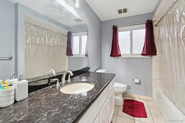 13439 Brougham Dr, Warren, MI 48312 - bathroom featuring vanity, tile patterned floors, toilet, shower / bathtub combination with curtain, and baseboards