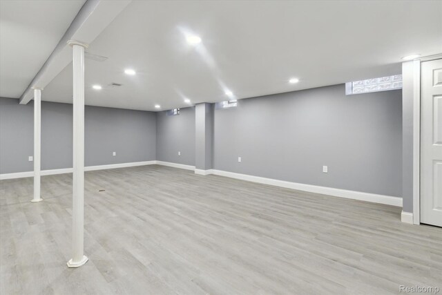 13439 Brougham Dr, Warren, MI 48312 - finished basement with baseboards, light wood finished floors, and recessed lighting