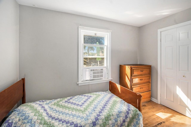 299 5th Ave, Manistee, MI 49660 - bedroom with cooling unit and wood finished floors