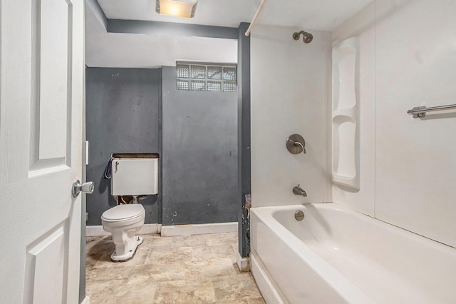 299 5th Ave, Manistee, MI 49660 - full bath featuring toilet, bathing tub / shower combination, and baseboards