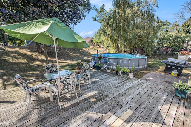 299 5th Ave, Manistee, MI 49660 - wooden terrace featuring outdoor dining area and area for grilling