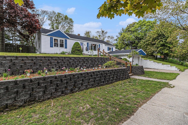 299 5th Ave, Manistee, MI 49660 - ranch-style house with a chimney and an outdoor structure