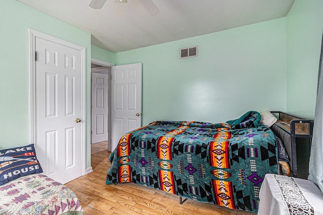 299 5th Ave, Manistee, MI 49660 - bedroom with wood finished floors and a ceiling fan