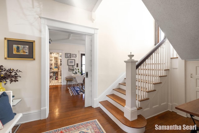 573 College Ave SE, Grand Rapids, MI 49503 - staircase with wood finished floors and baseboards