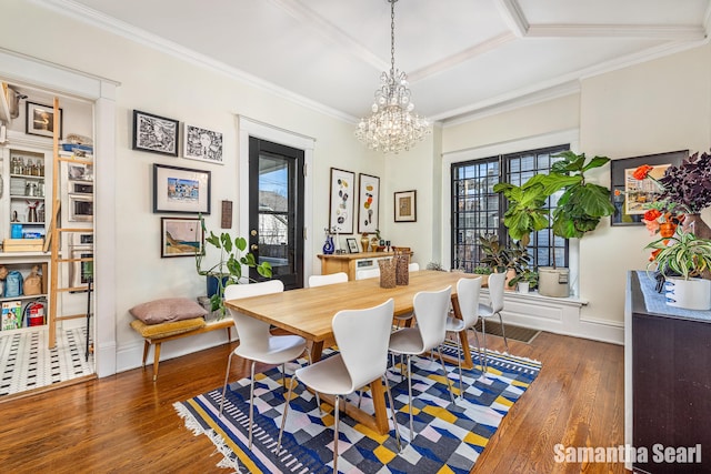 573 College Ave SE, Grand Rapids, MI 49503 - dining space with hardwood / wood-style floors, baseboards, a chandelier, and crown molding