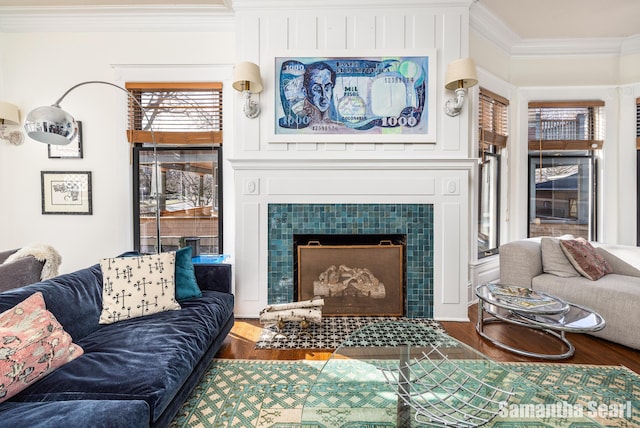 573 College Ave SE, Grand Rapids, MI 49503 - living area with ornamental molding, a fireplace, and wood finished floors