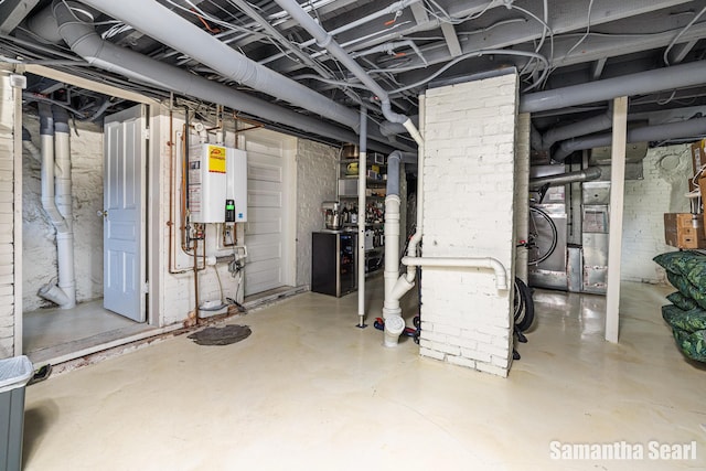 573 College Ave SE, Grand Rapids, MI 49503 - unfinished below grade area featuring tankless water heater