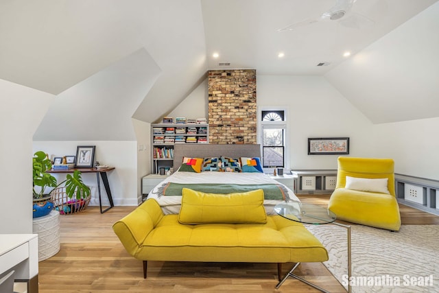573 College Ave SE, Grand Rapids, MI 49503 - bedroom featuring lofted ceiling, wood finished floors, and recessed lighting