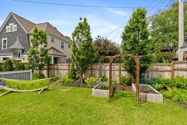 573 College Ave SE, Grand Rapids, MI 49503 - view of yard featuring a vegetable garden