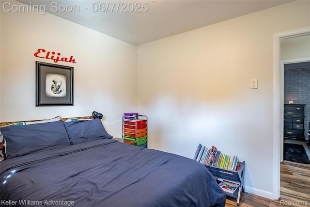 4879 Sundale Dr, Clarkston, MI 48346 - bedroom featuring wood finished floors and baseboards