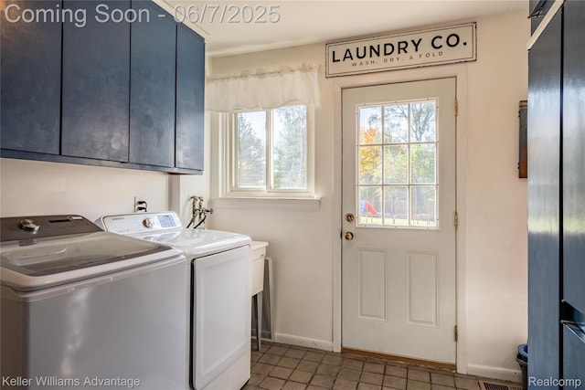 4879 Sundale Dr, Clarkston, MI 48346 - washroom featuring cabinet space, independent washer and dryer, baseboards, and tile patterned floors