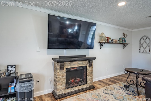 4879 Sundale Dr, Clarkston, MI 48346 - living room with a textured ceiling, a stone fireplace, wood finished floors, crown molding, and baseboards