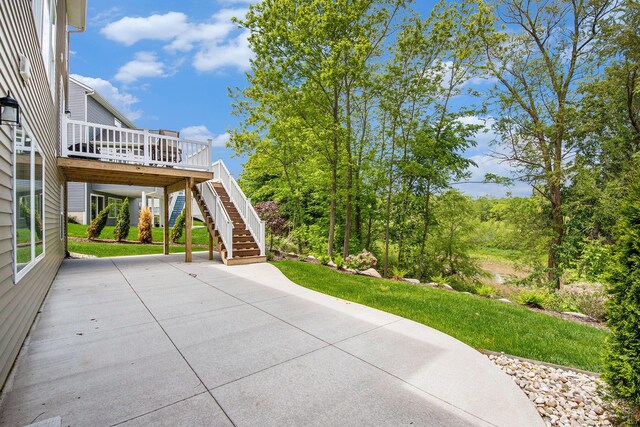 883 Water Ridge Dr, Byron Center, MI 49315 - view of patio featuring stairs and a deck